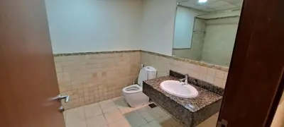 a bathroom with a sink and a toilet at Zaman Vacation Homes in Dubai