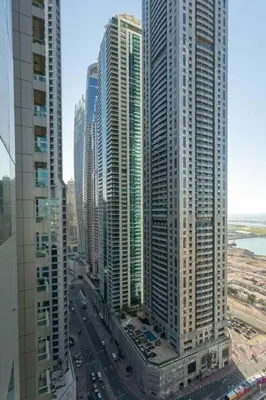 an aerial view of a city with tall buildings at Walk to Metro, Tram & Beach, Stylish 1BR in Marina Pinnacle, Dubai Marina by Deluxe Holiday Homes in Dubai