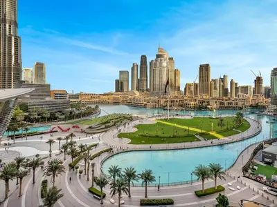 a view of a city skyline with a park at Grande Signature Residence 907 Full Burj Khalifa and Dubai Dancing Fountain View 5 Min Walk Dubai Mall Luxury Downtown Apartment in Dubai