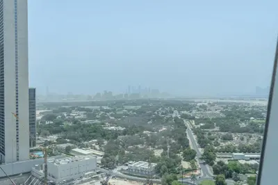 a view of a city from a skyscraper at StayShort - Stylish DIFC Apartment Sleeps 4 with Pool & Gym in Dubai
