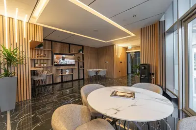 a meeting room with a white table and chairs at StayShort - Stylish DIFC Apartment Sleeps 4 with Pool & Gym in Dubai