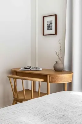 a wooden table with a book on it in a bedroom at Waterfront View, Boutique apartment, Lagoon Access in Dubai