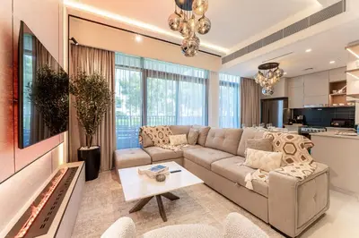 a living room with a couch and a table at HAVN - Luxurious 4 Bed Villa in Arabian Ranches 3 in Dubai