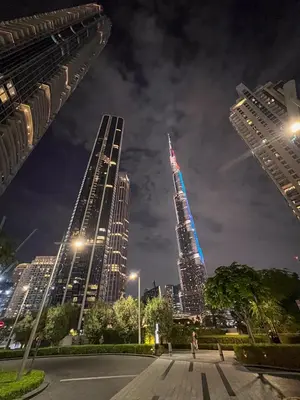 a view of a city skyline at night at Stunning Burj Khalifa & Fountain Views in Dubai