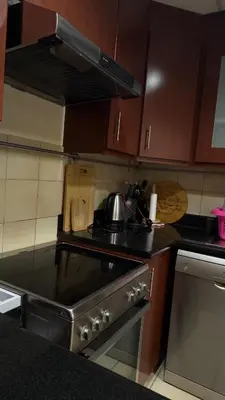 a kitchen with a stove with a tea pot on it at Marina View Luxury Retreat Modern Apartment JBR Dubai in Dubai