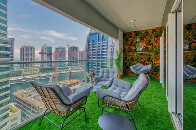 a balcony with chairs and a view of a city at GuestReady - Sleek city retreat in Business Bay in Dubai