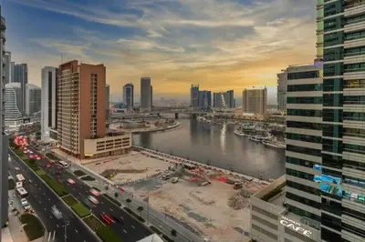 a view of a city with a river and buildings at GuestReady - Sleek city retreat in Business Bay in Dubai