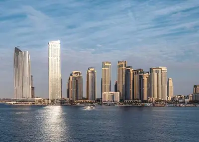 a skyline of a city with skyscrapers in the water at DB HOMs in Dubai