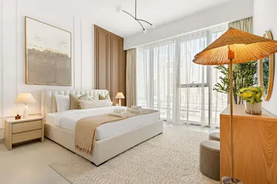 a bedroom with a white bed and a large window at Silkhaus Charming 1BDR in Canal Front Tower in Dubai