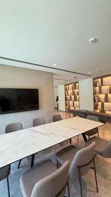 a conference room with a large table and chairs at Luxury 2BR Downtown ,5 min walk to Burj Khalifa and Dubai Mall in Dubai