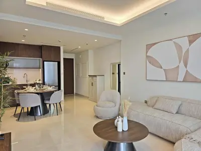 a living room with a couch and a table at Brand New 1BR , Fully Furnished in Dubai