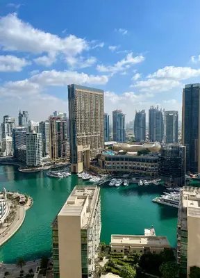 a view of a city with boats in the water at Fav 2-Bedroom by The Beach in JBR Bahar with stunning Marina View in Dubai