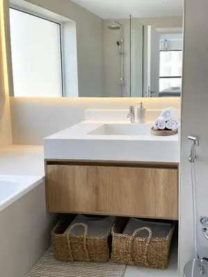 a bathroom with a sink and a mirror at Fav 2-Bedroom by The Beach in JBR Bahar with stunning Marina View in Dubai