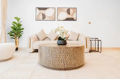 a living room with a couch and a coffee table at Escape24 Luxury 1BR with Sea View and Beach Access, Dubai Harbour in Dubai