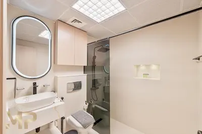 a bathroom with a sink and a mirror at Marcopolo -Enjoy Marina views from a cozy 1BR in Dubai Marina in Dubai