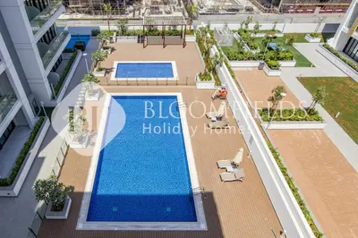 an overhead view of a swimming pool on a building at Bloomfields Deluxe Studio In Azizi Riviera in Dubai
