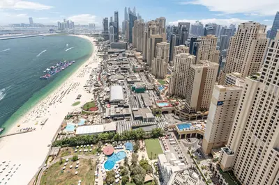 an aerial view of a city with a beach and buildings at JBR Home with incredible View & Private Beach in Dubai
