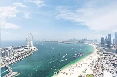 an aerial view of a beach with a ferris wheel at JBR Home with incredible View & Private Beach in Dubai