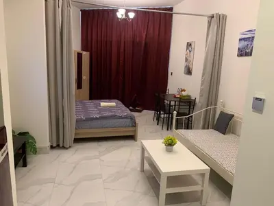 a living room with a bed and a couch at Millennium Binghatti Residence - Business Bay - Homeyvillas in Dubai