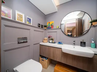 a bathroom with a sink and a mirror at Family Friendly Villa in Tilal Al Ghaf with Garden and Padel Courts Pet Friendly in Dubai