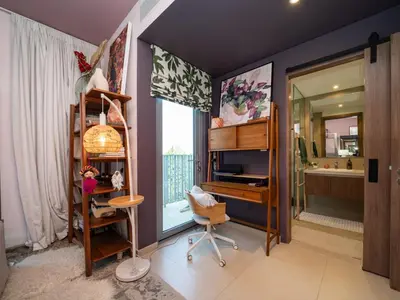 a bedroom with a desk and a bathroom with a tub at Family Friendly Villa in Tilal Al Ghaf with Garden and Padel Courts Pet Friendly in Dubai