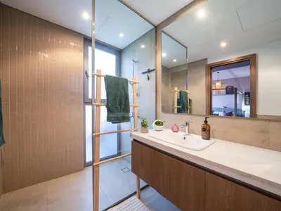 a bathroom with a sink and a mirror at Family Friendly Villa in Tilal Al Ghaf with Garden and Padel Courts Pet Friendly in Dubai