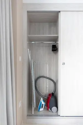 a cabinet with a fire hose in a room at Elegant Beachside Studio in Prime Palm Location in Dubai
