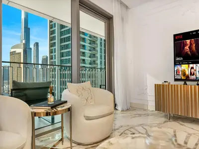 a living room with a view of a city at Elie Saab Collection by Luxe Manor - Dubai Mall Residences in Dubai