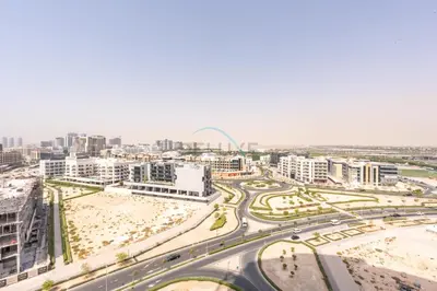 an aerial view of a city with buildings and roads at Studio Near Dubai Butterfly Garden, 18 Mins Drive From Mall of Emirates, Miraclz Tower, Arjan By Deluxe Holiday Homes in Dubai