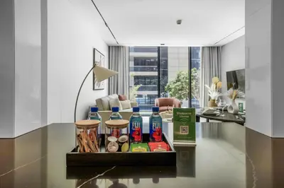 a tray with drinks on a table in a room at New 2BR with Private Jacuzzi in City Centre in Dubai