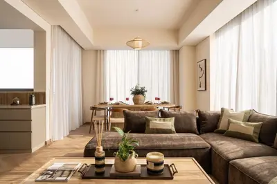a living room with a couch and a table at Seraya Residences at 52-42 EMAAR in Dubai