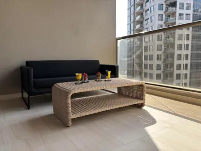 a living room with a couch and a coffee table at Luxury Downtown Studio - Elite Downtown Residence 1 - Burj Khalifa View Balcony in Dubai