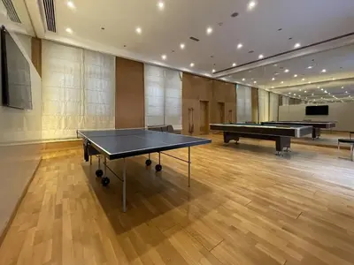 a room with a ping pong table and two pool tables at Modern 2BR in the heart of Downtown Dubai in Dubai