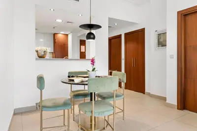 a dining room with a table and chairs at Burj Vista - Prime Downtown Dubai in Dubai