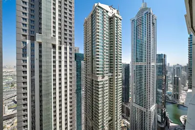 a group of tall buildings in a city at High-Floor 1BR at Elite Residence, Dubai Marina in Dubai