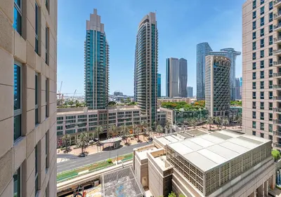 an aerial view of a city with tall buildings at Stunning 1 BR Apartment Walk to Burj Khalifa & Dubai mall in Dubai