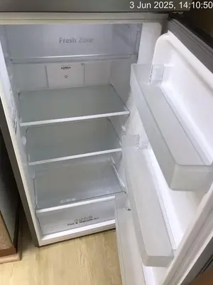 an empty refrigerator with its door open at Cozy 1 Bed aprt in Marina Diamond 1 Tower in Dubai