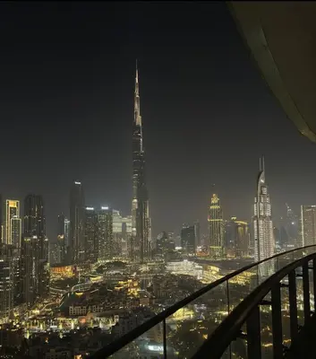 a view of a city skyline at night at Full BurjKhalifa View - Luxury 2BR in 5Stars Hotel in Dubai