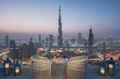 a view of a city skyline from a balcony at Spacious 2BR with Balcony, Stunning Burj Views & Steps from Bay Avenue Park in Dubai