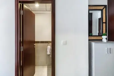 a bathroom with a shower with a glass door at 29 Boulevard Tower 1 Apartment by GLOBALSTAY in Dubai