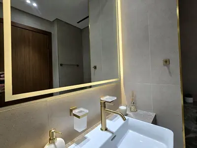 a bathroom with a sink and a mirror at Kazan Homes - Lux - Studio Close to Burj Khalifa & Dubai Mall - Business Bay in Dubai