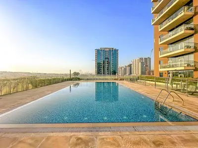 a swimming pool in the middle of a building at FIRST CLASS Studio Classy Comfort in Dubai