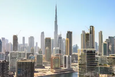 a view of a large city with skyscrapers at High-Floor 1BR with Burj Khalifa View Prime Location in Dubai