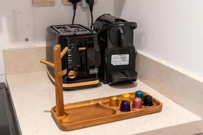 a kitchen counter with a coffee maker on a counter at Elite apartment near Dubai Mall in Dubai