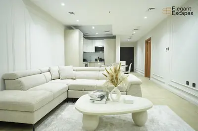 a living room with a couch and a table at Stylish 1B in Heart of Marina Near Attractions in Dubai