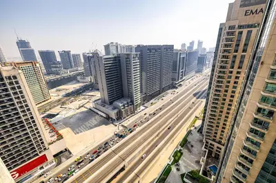 an aerial view of a busy city with traffic at Burj Nujoom I Studio I Downtown in Dubai