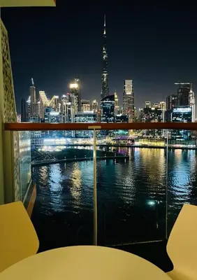 a view of a city at night from a balcony at Millennium Binghatti Studio I Business bay I Studio in Dubai