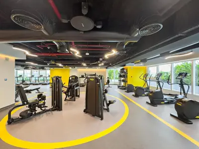 a gym with treadmills and elliptical machines at VayK - Comfortable Studio in JLT with Amazing Amenities in Dubai