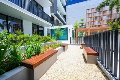 a row of benches in front of a building at Golden Stays - Brand New JVC Studio I Modern & Fully Furnished in Dubai