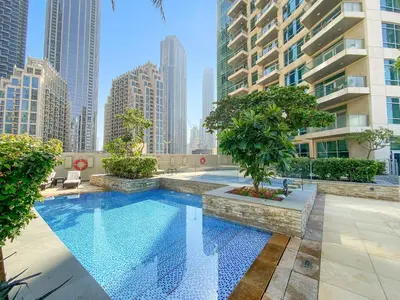 a swimming pool in a city with tall buildings at VayK - Modern 1BR apartment in the Heart of Downtown Dubai in Dubai